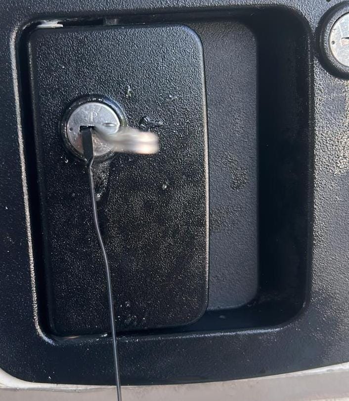 Locksmith opening a locked RV entry door