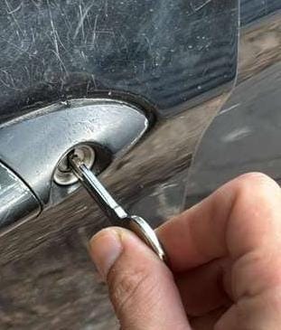 Newly cut key unlocking a car door