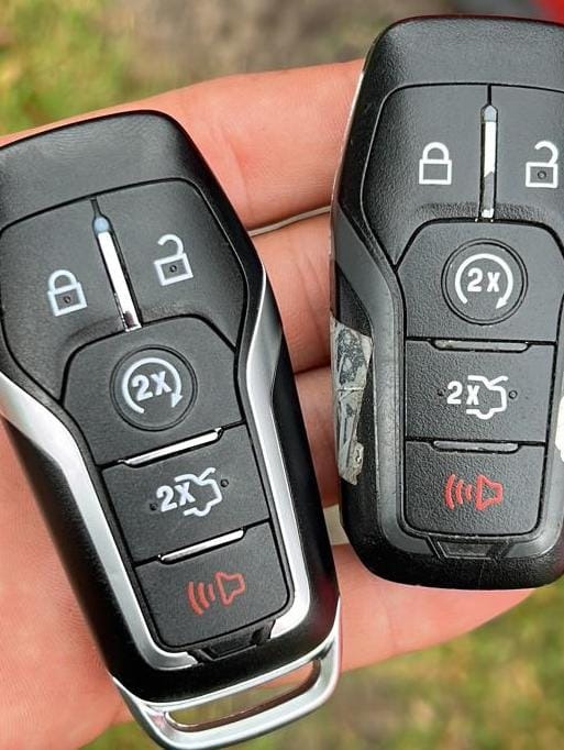 Original car key fob and a programmed copy side by side