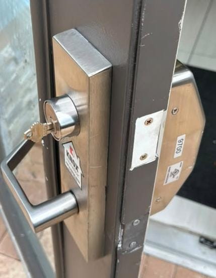 Exit device trim with a rekeyed cylinder