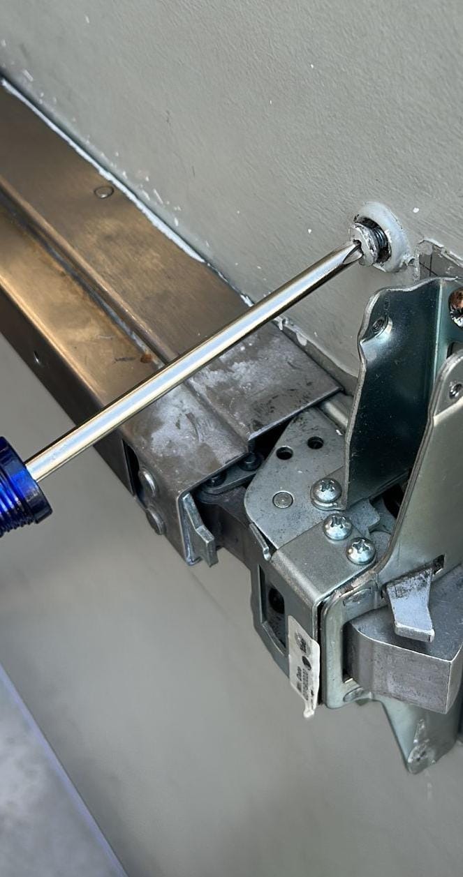 Push bar exit device being installed on a facility door