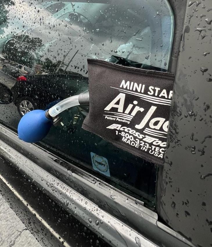 Air wedge and reach tool opening a locked car door
