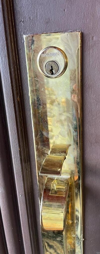 Decorative handle and mortise set installed on a door