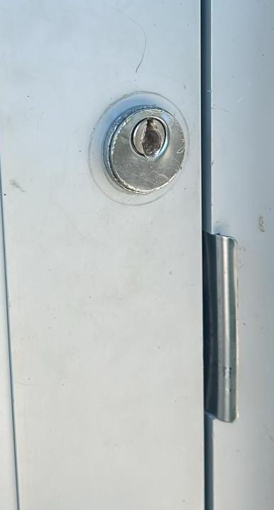 Drilled mortise lock cylinder on a business door lockout