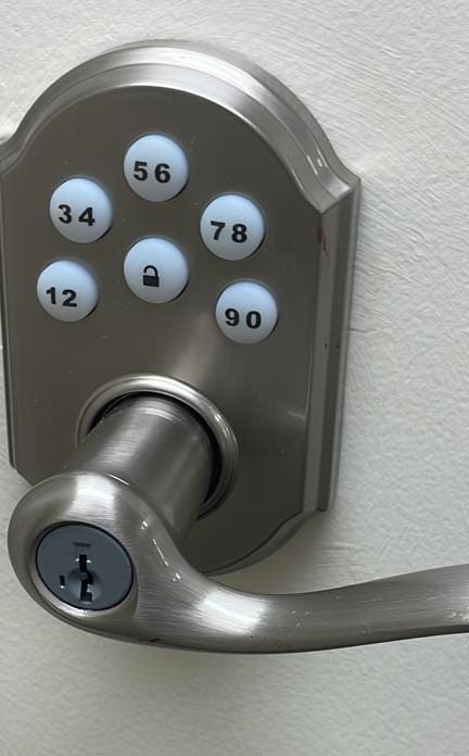 Keypad lever handle installed on a door